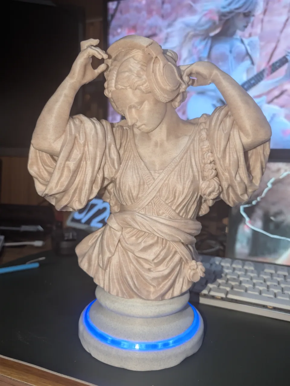 Busto con base iluminada · fotografía real 3